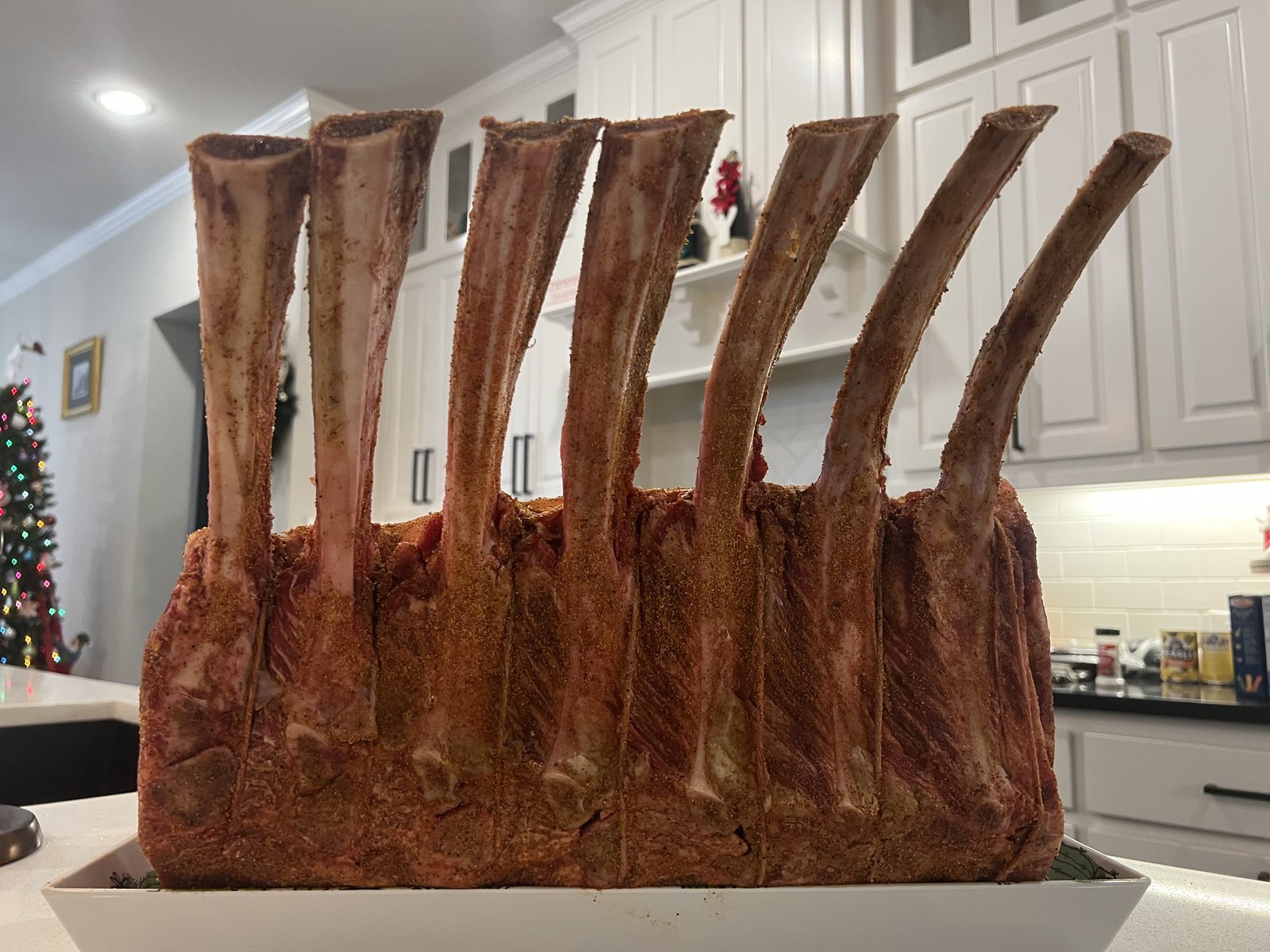 A smoked rib roast resting on the grill at a Tompkins family cookout